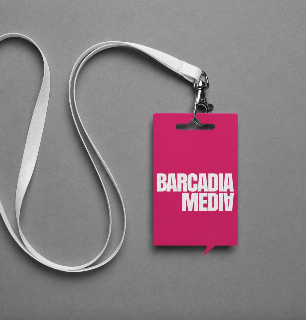 Barcadia Media event pass on a white lanyard