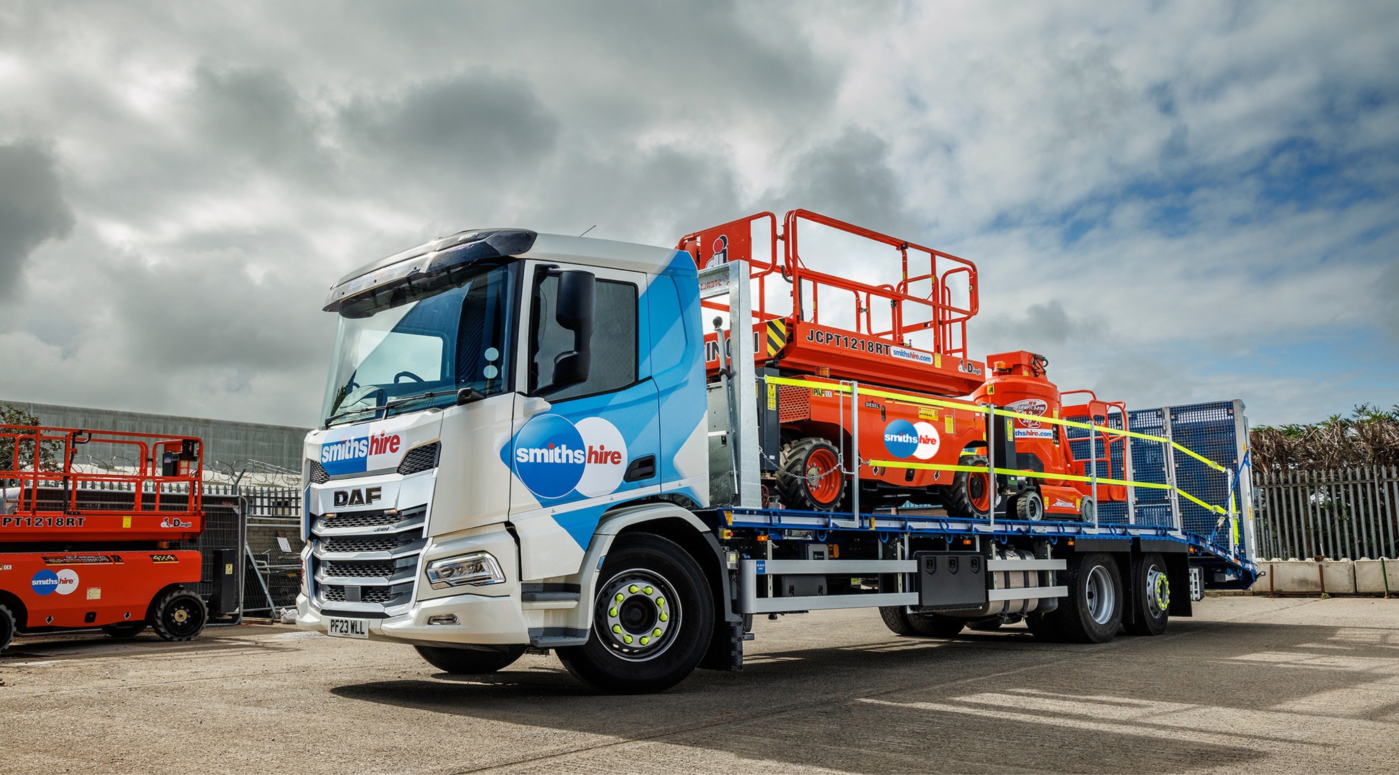 Smiths Hire liveried DAF truck loaded with orange access platforms