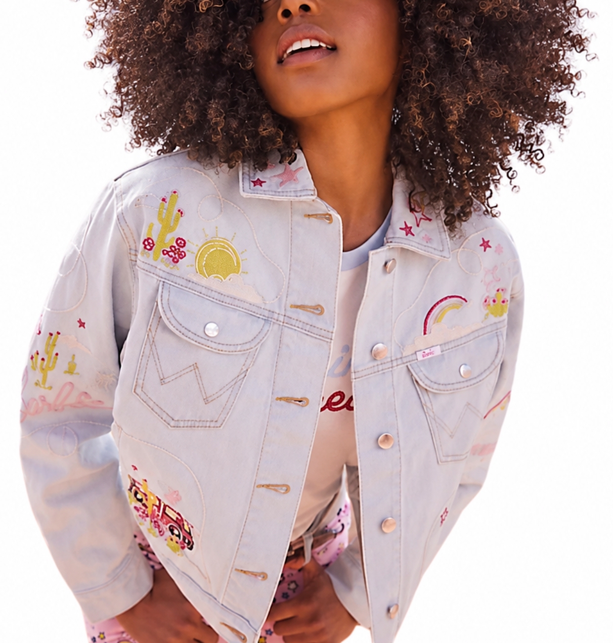 Model in an embroidered pale denim Wrangler jacket