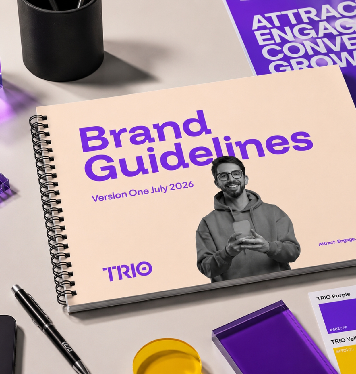 The TRIO Brand Guidelines book, version one, on the studio desk